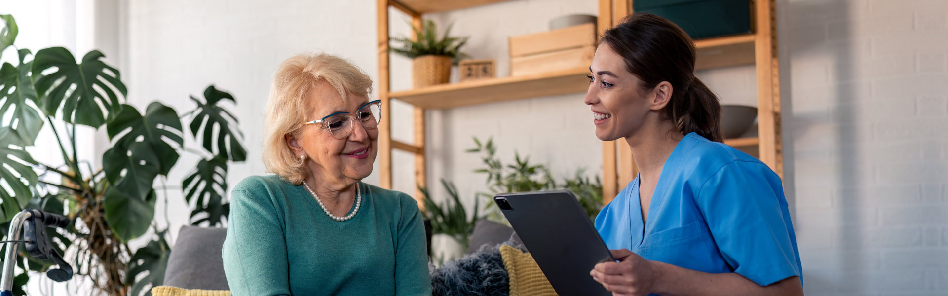Caregiver talking to elderly